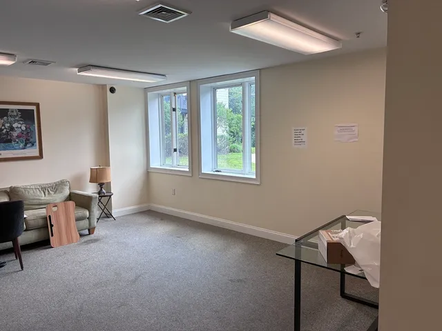 a car parked in front of white house