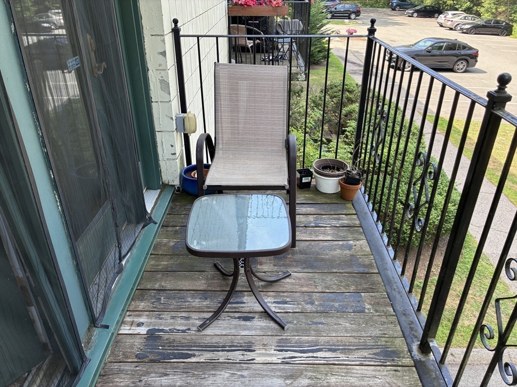 25 Alpine Street, Unit 7 Boston, MA 02136 - Photo 10 of 16 a view of balcony and wooden floor