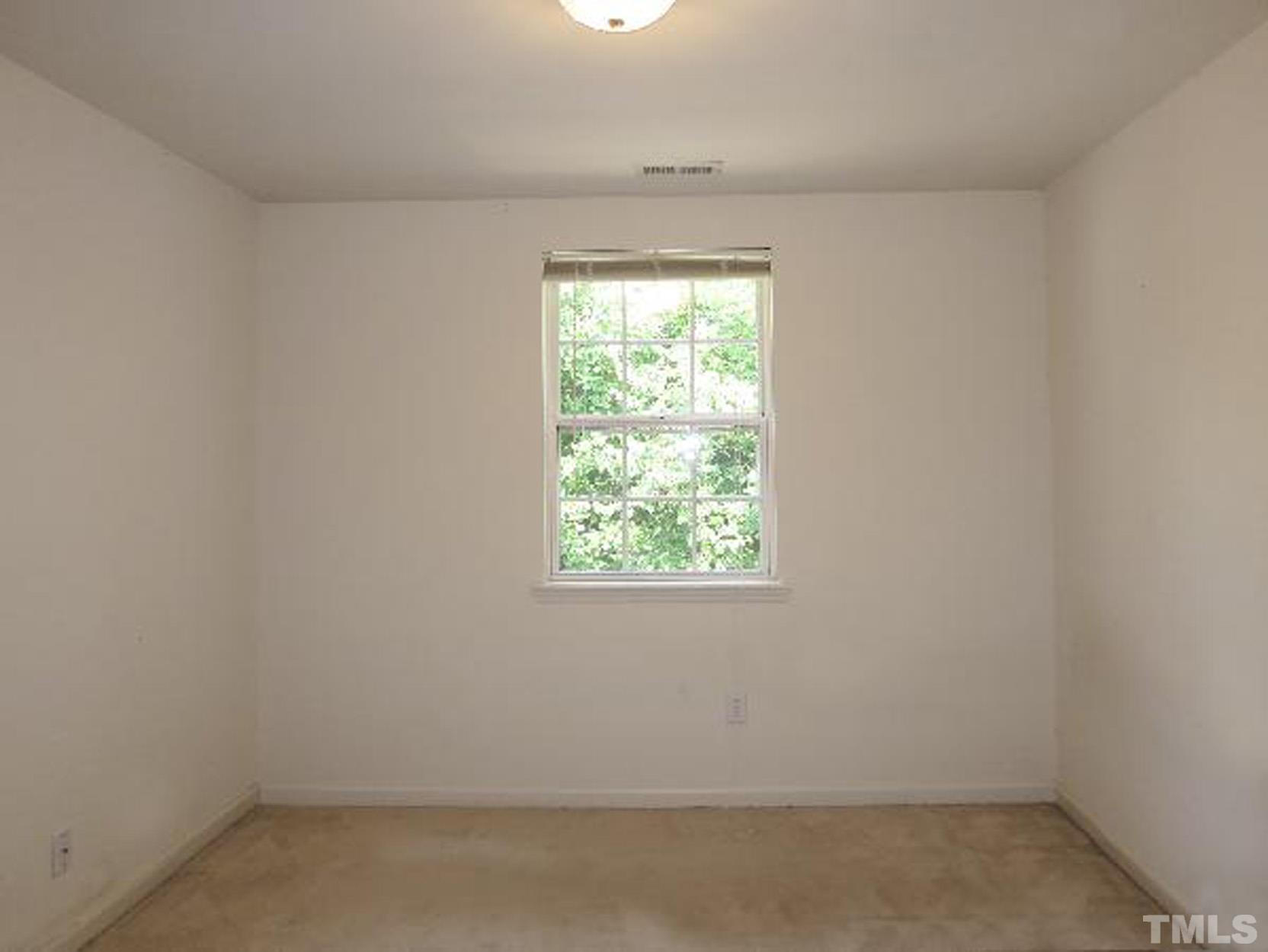 101 Rock Haven Road, Unit A103 Carrboro, NC 27510 - Photo 11 of 17 an empty room with a window