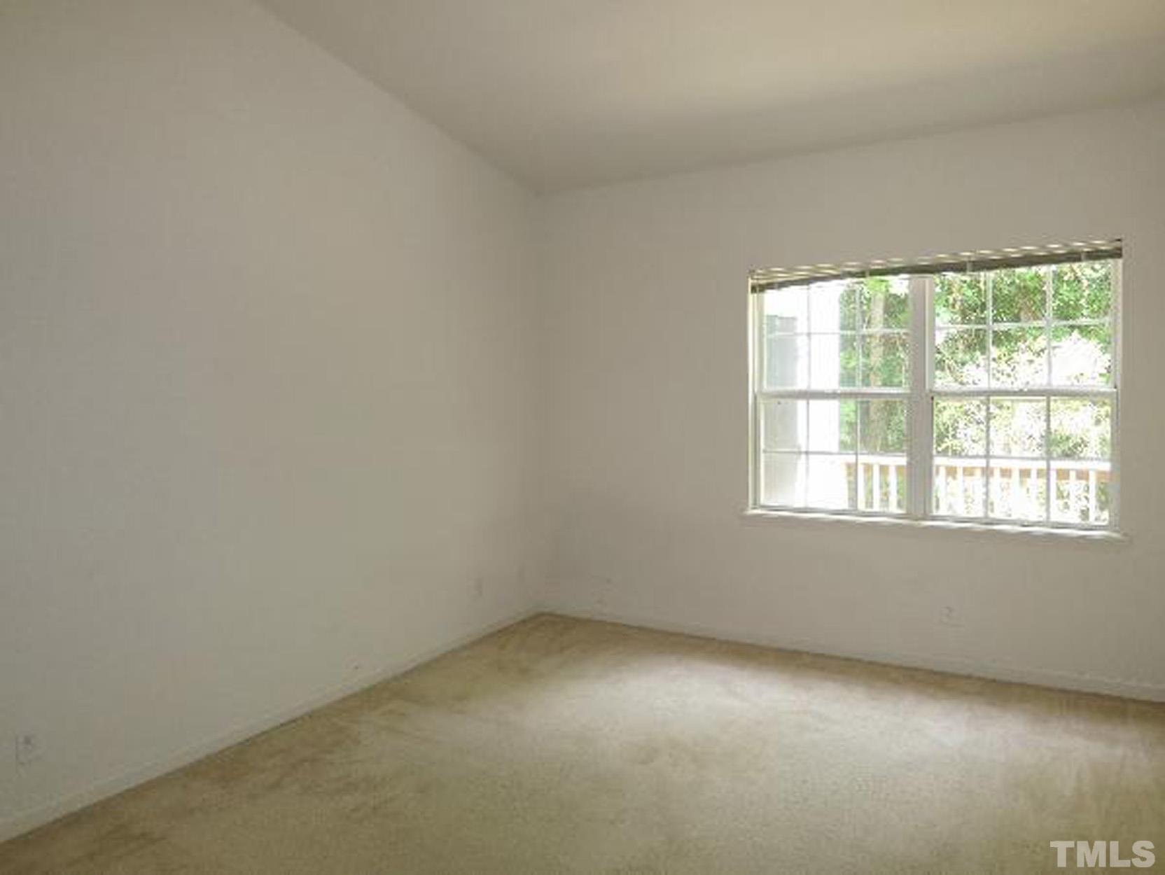 101 Rock Haven Road, Unit A103 Carrboro, NC 27510 - Photo 8 of 17 an empty room with a window