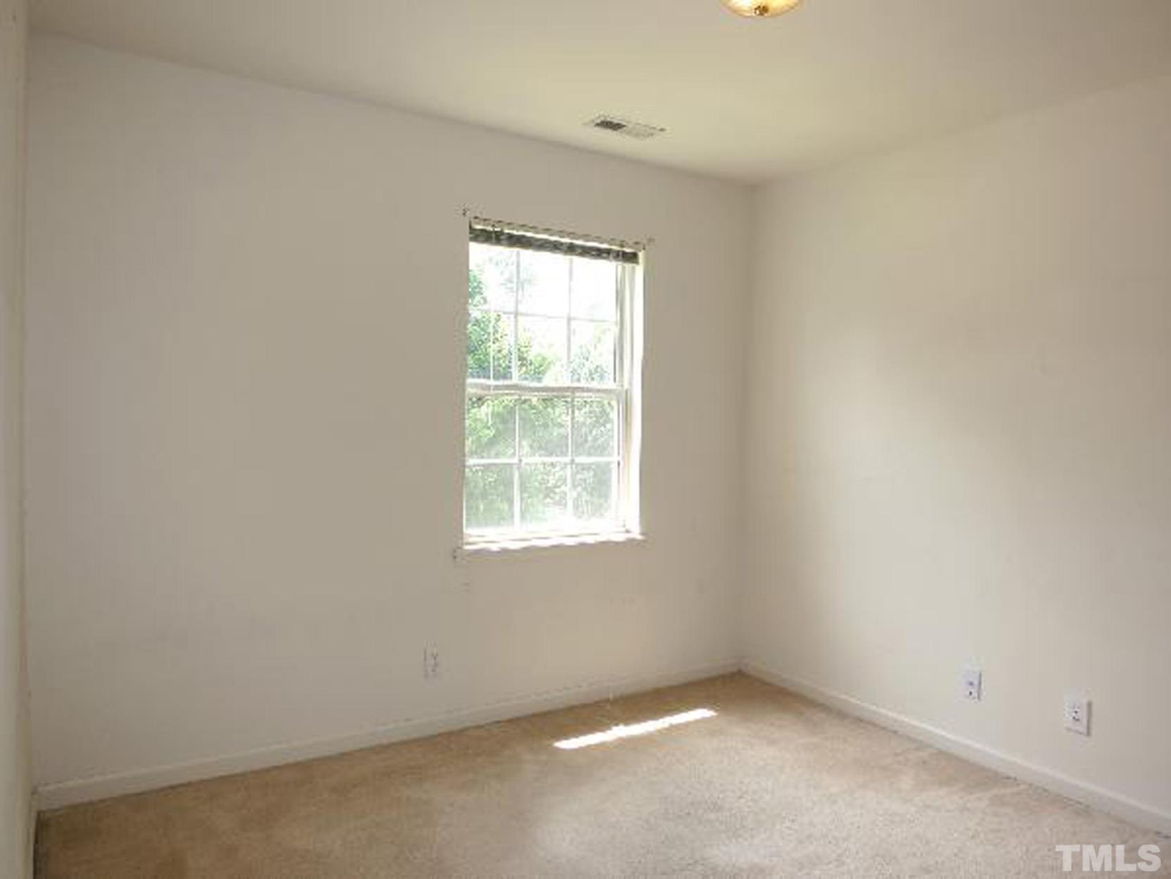 101 Rock Haven Road, Unit A103 Carrboro, NC 27510 - Photo 10 of 17 an empty room with a window