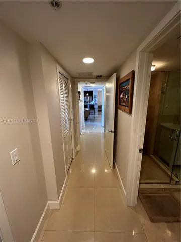 a view of a hallway with a livingroom