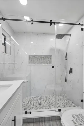 a bathroom with a sink and a shower
