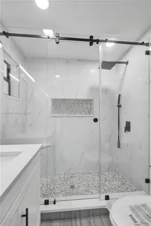a bathroom with a sink and a shower