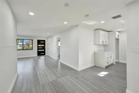 a view of kitchen with wooden floor and window