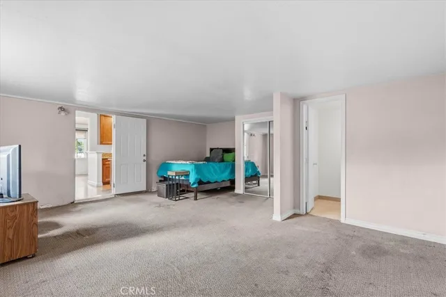 a view of a livingroom with furniture and a flat screen tv