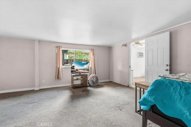 a view of a livingroom with furniture and a window