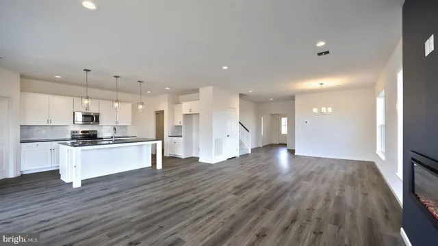 a view of kitchen with stainless steel appliances refrigerator oven and stove