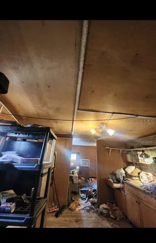 a kitchen with a refrigerator and a stove