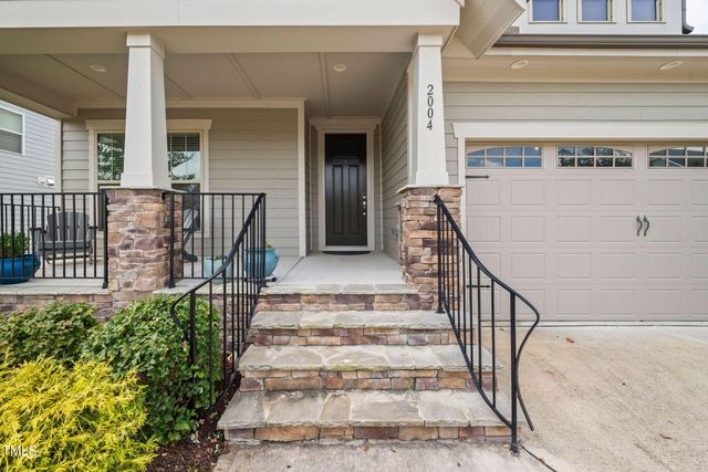 a view of a balcony with a potted plant