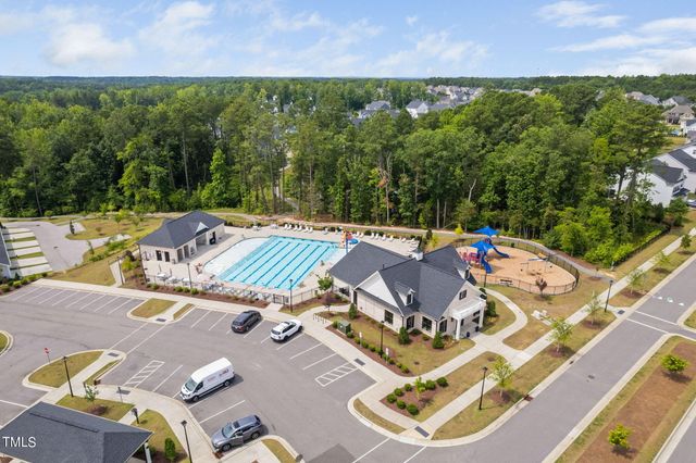 an aerial view of a house with a big yard