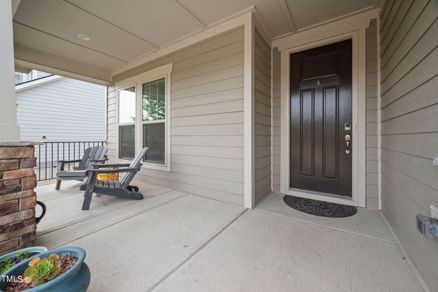 a backyard of a house with outdoor seating