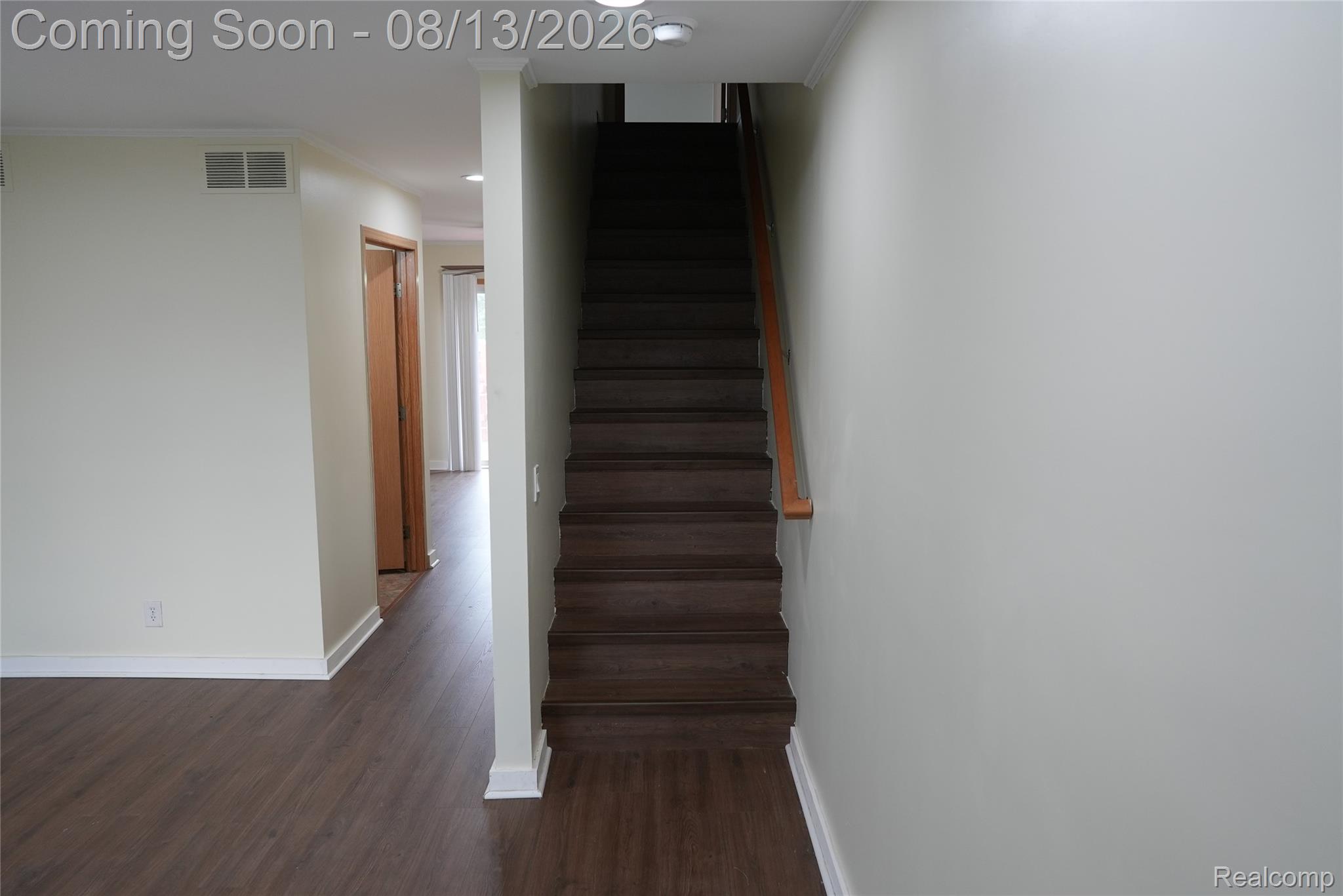 2018 John R Road Troy, MI 48083 - Photo 11 of 57 Recessed ceiling lighting, wood-finish flooring, light-toned walls, wooden handrail, and white trim