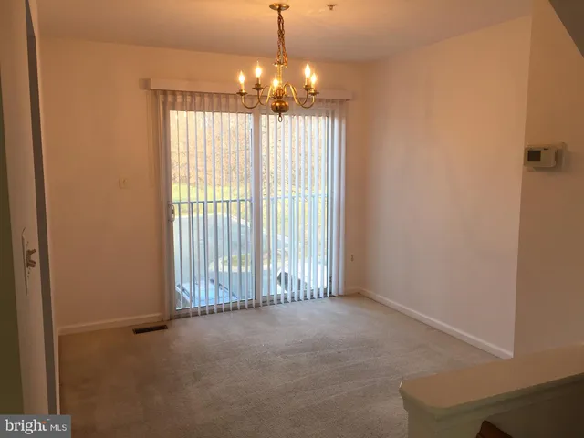 a kitchen with white cabinets sink and appliances