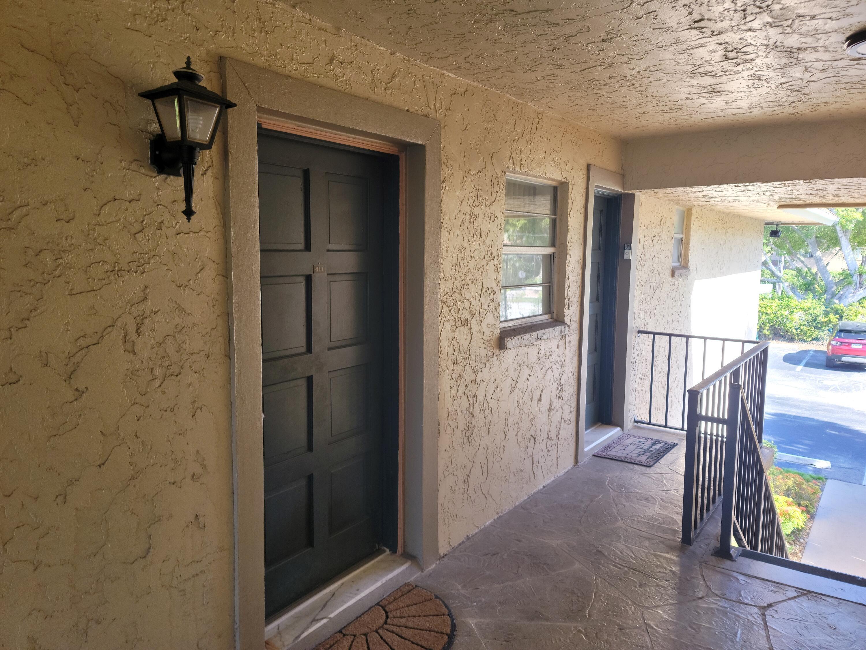 1301 Northwest 12th Avenue, Unit 411A Boca Raton, FL 33486 - Photo 25 of 32 FRONT DOOR