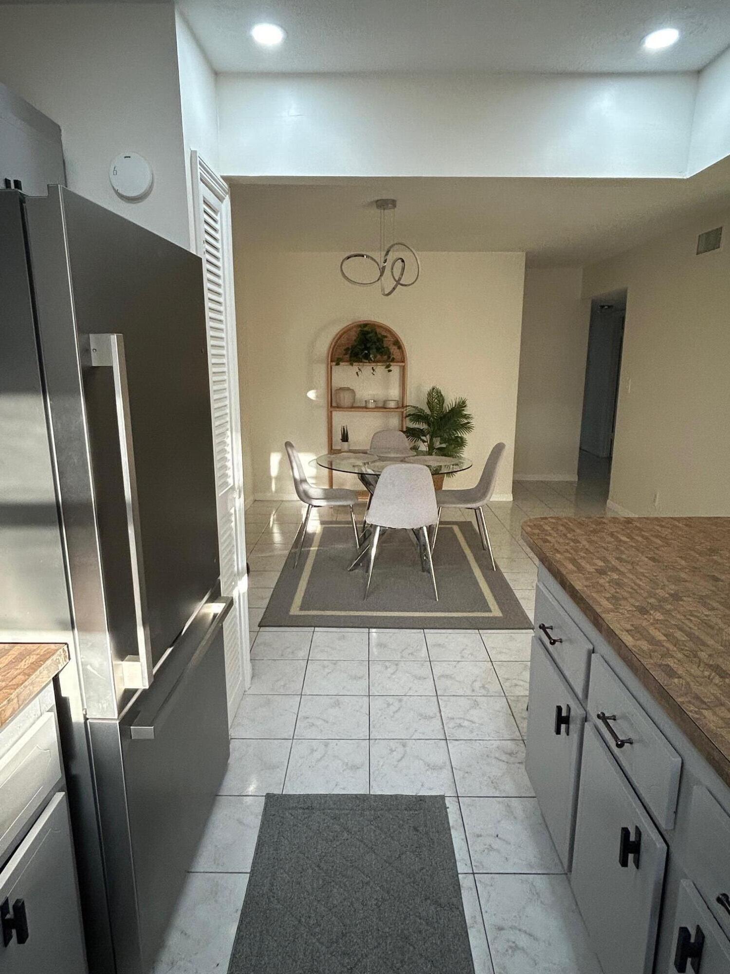 1301 Northwest 12th Avenue, Unit 411A Boca Raton, FL 33486 - Photo 6 of 32 From Kitchen Looking into Dining Room