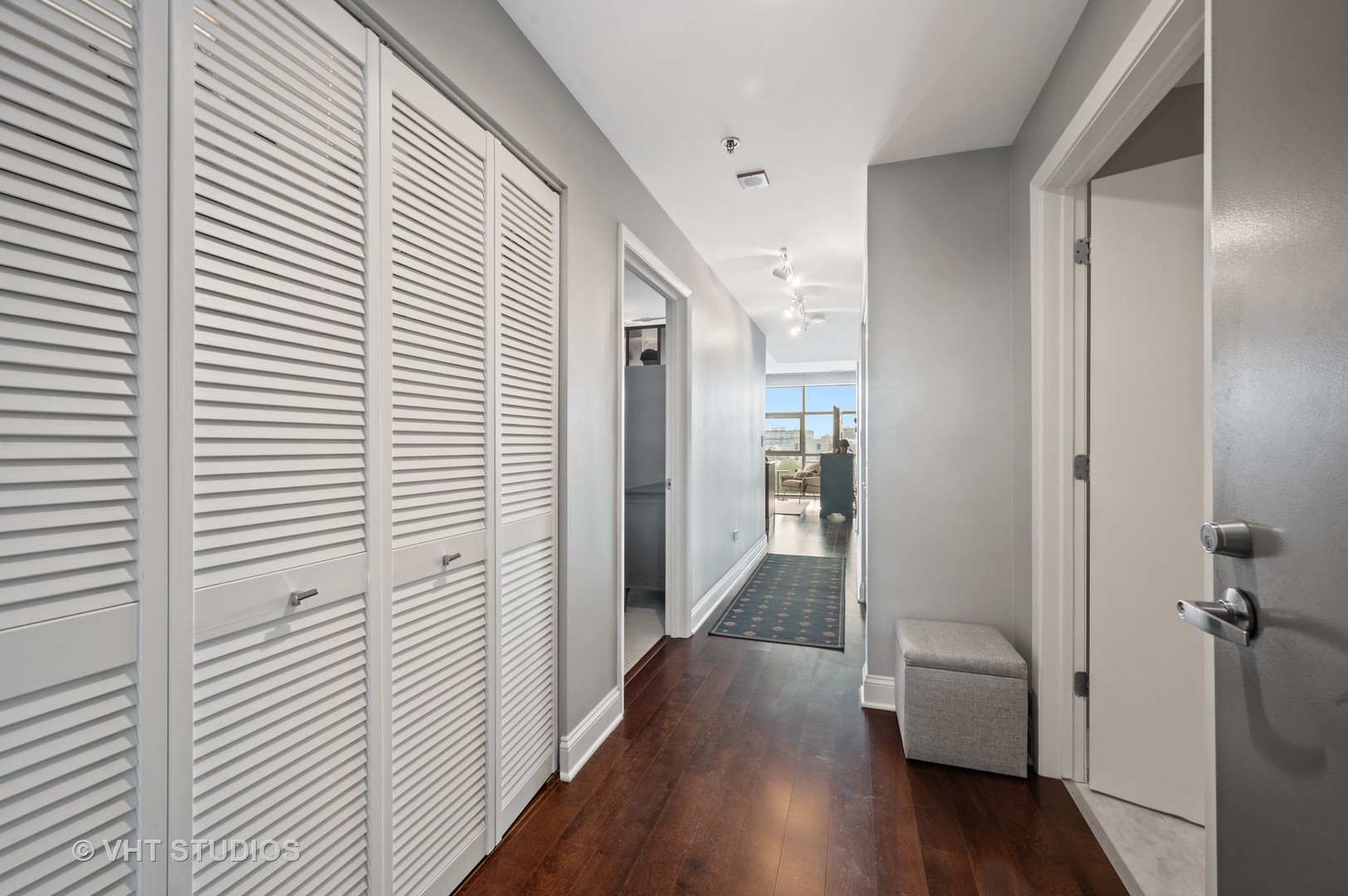 225 South Sangamon Street, Unit 509 Chicago, IL 60607 - Photo 2 of 20 a view of a hallway with wooden floor and closet area