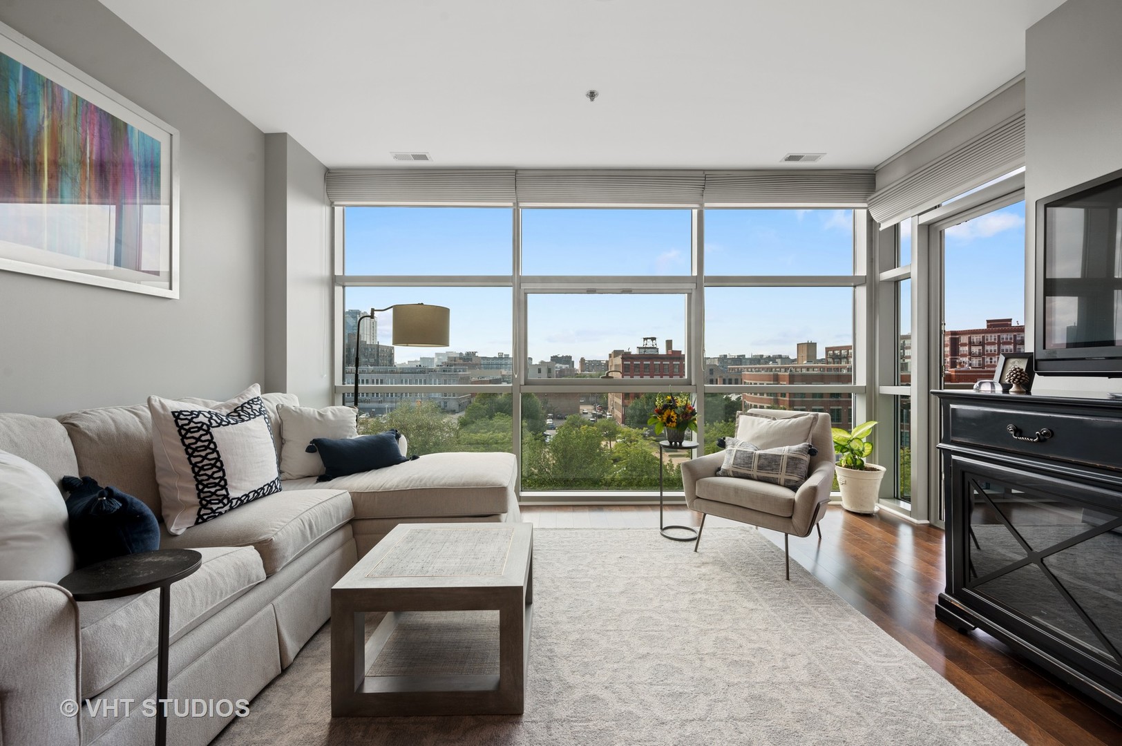 225 South Sangamon Street, Unit 509 Chicago, IL 60607 - Photo 3 of 20 a living room with furniture and a floor to ceiling window