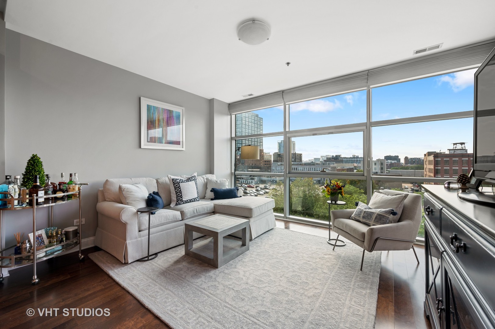 225 South Sangamon Street, Unit 509 Chicago, IL 60607 - Photo 4 of 20 a living room with furniture and a floor to ceiling window