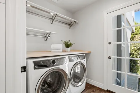 a bedroom with a large bed and a large window