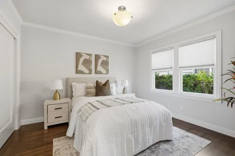 a bathroom with a sink a mirror and shower