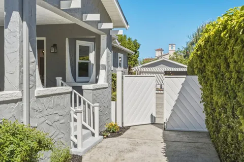 a backyard of a house with seating space
