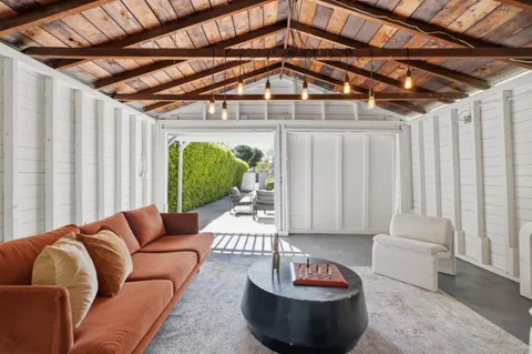 a room with lots of chairs and windows