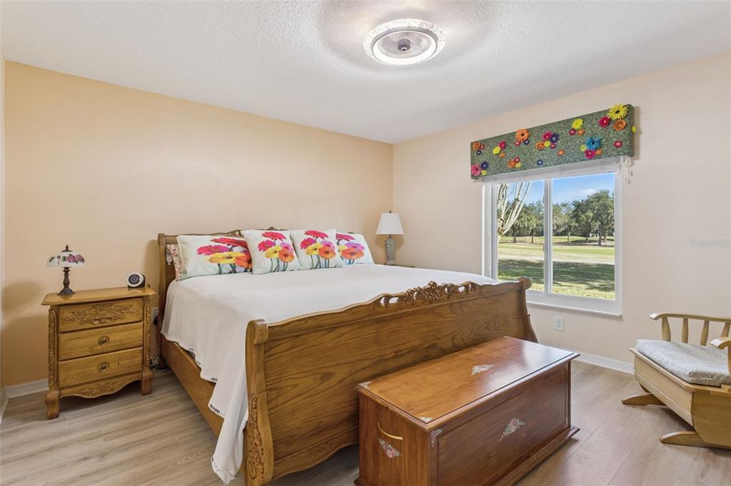 3601 Arlington Ridge Boulevard Leesburg, FL 34748 - Photo 15 of 44 a bed sitting in a bedroom next to a window