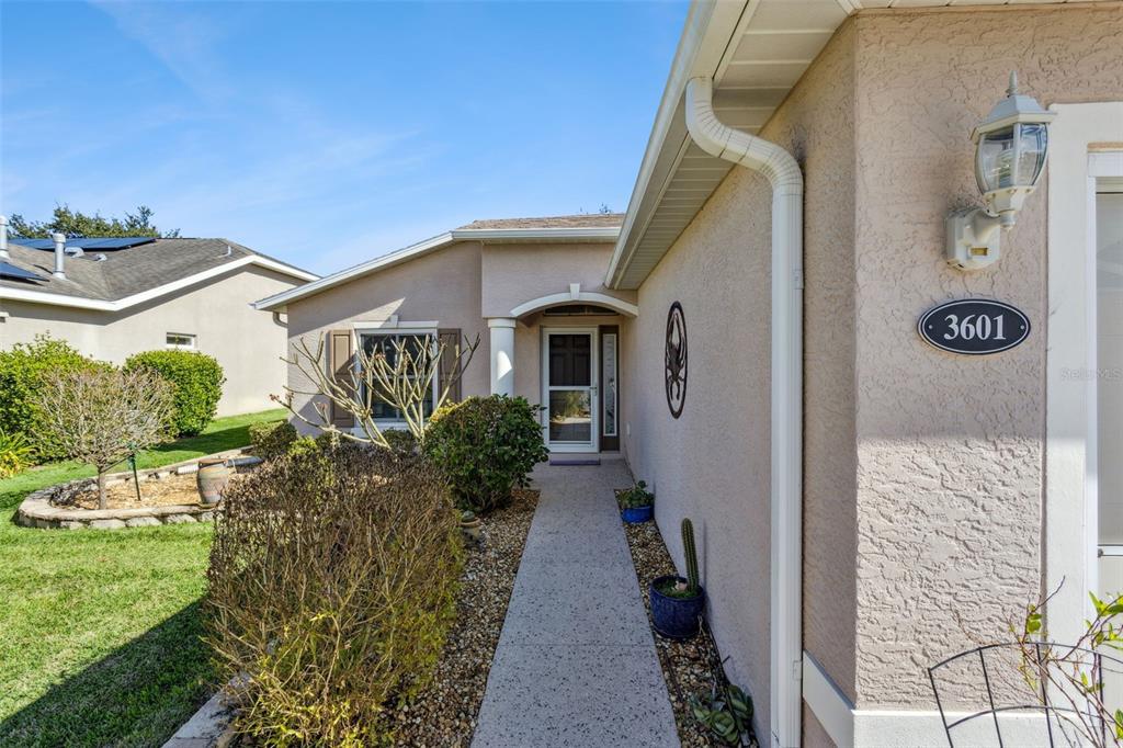 3601 Arlington Ridge Boulevard Leesburg, FL 34748 - Photo 4 of 44 a front view of a house with a yard