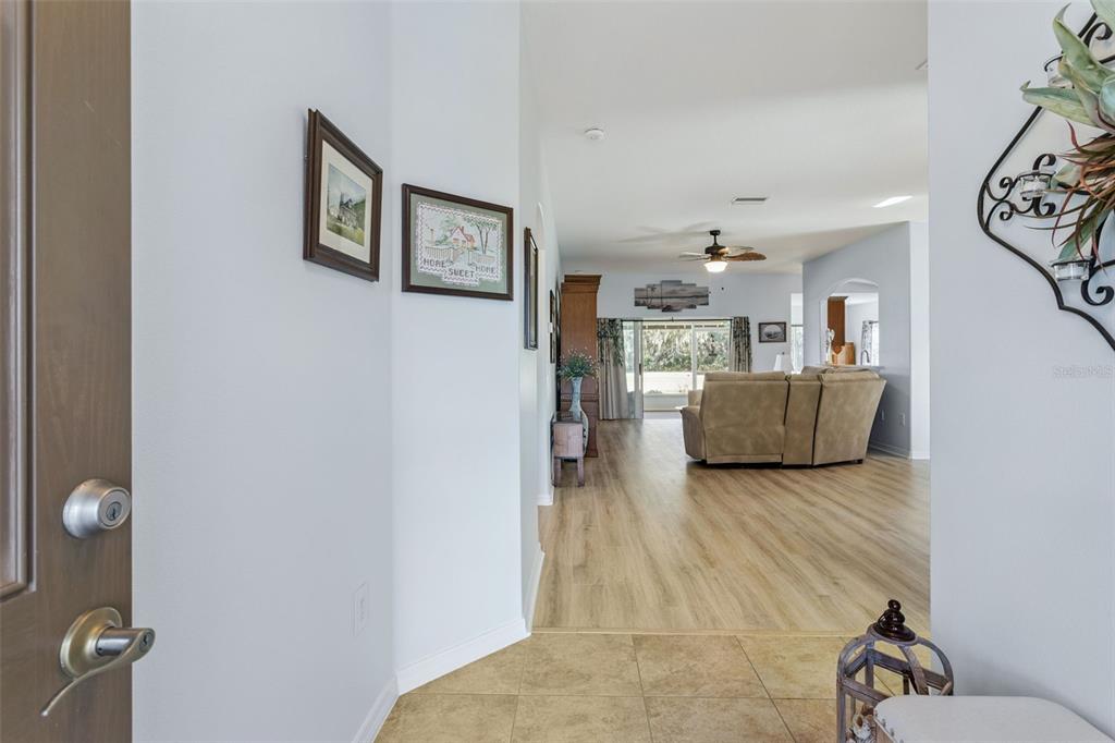 3601 Arlington Ridge Boulevard Leesburg, FL 34748 - Photo 5 of 44 a living room with furniture and a wooden floor