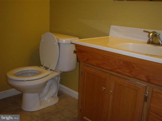 6151 Good Hunters Ride Columbia, MD 21045 - Photo 14 of 17 a bathroom with a toilet and a sink