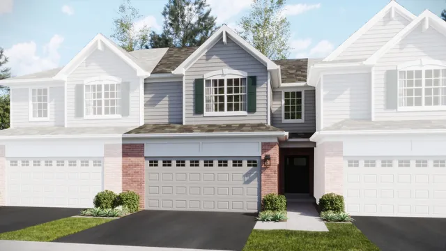 a front view of a house with a garden and plants