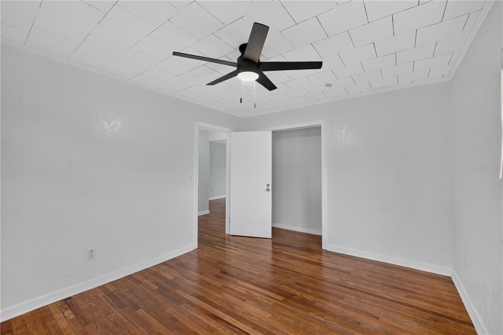 5514 Southeast Hames Road Belleview, FL 34420 - Photo 10 of 44 a view of empty room with wooden floor