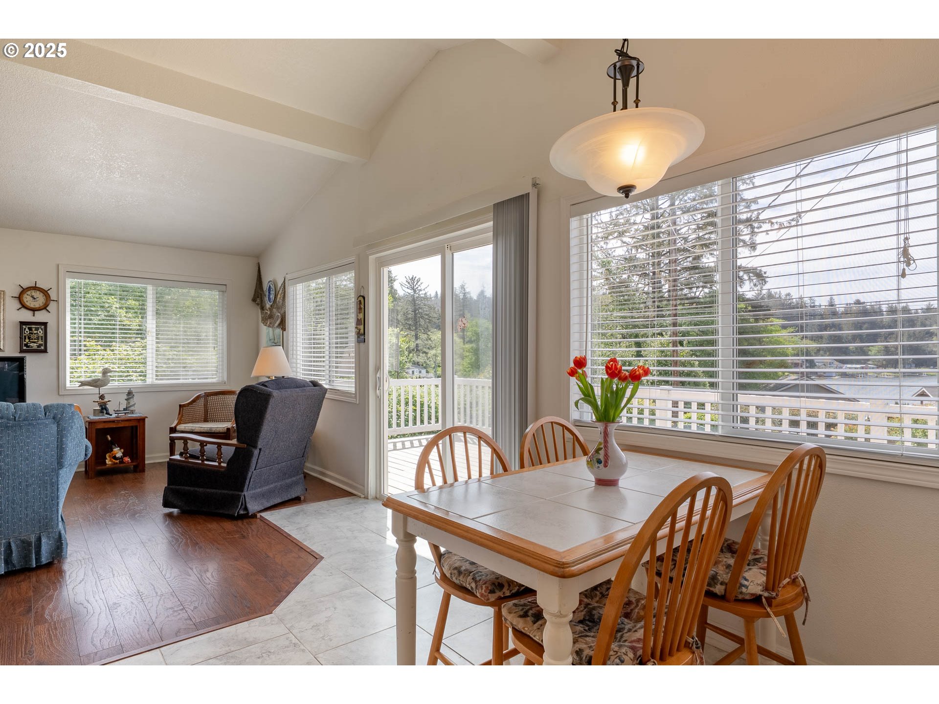 5305 Northeast 49th Street Neotsu, OR 97364 - Photo 20 of 32 a living room with furniture a window and a potted plant