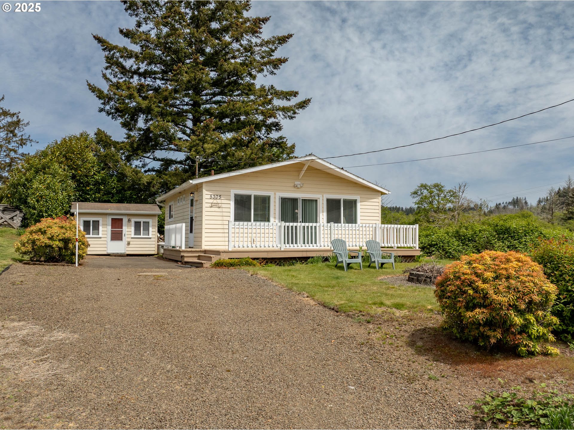5305 Northeast 49th Street Neotsu, OR 97364 - Photo 2 of 32 a front view of a house with garden