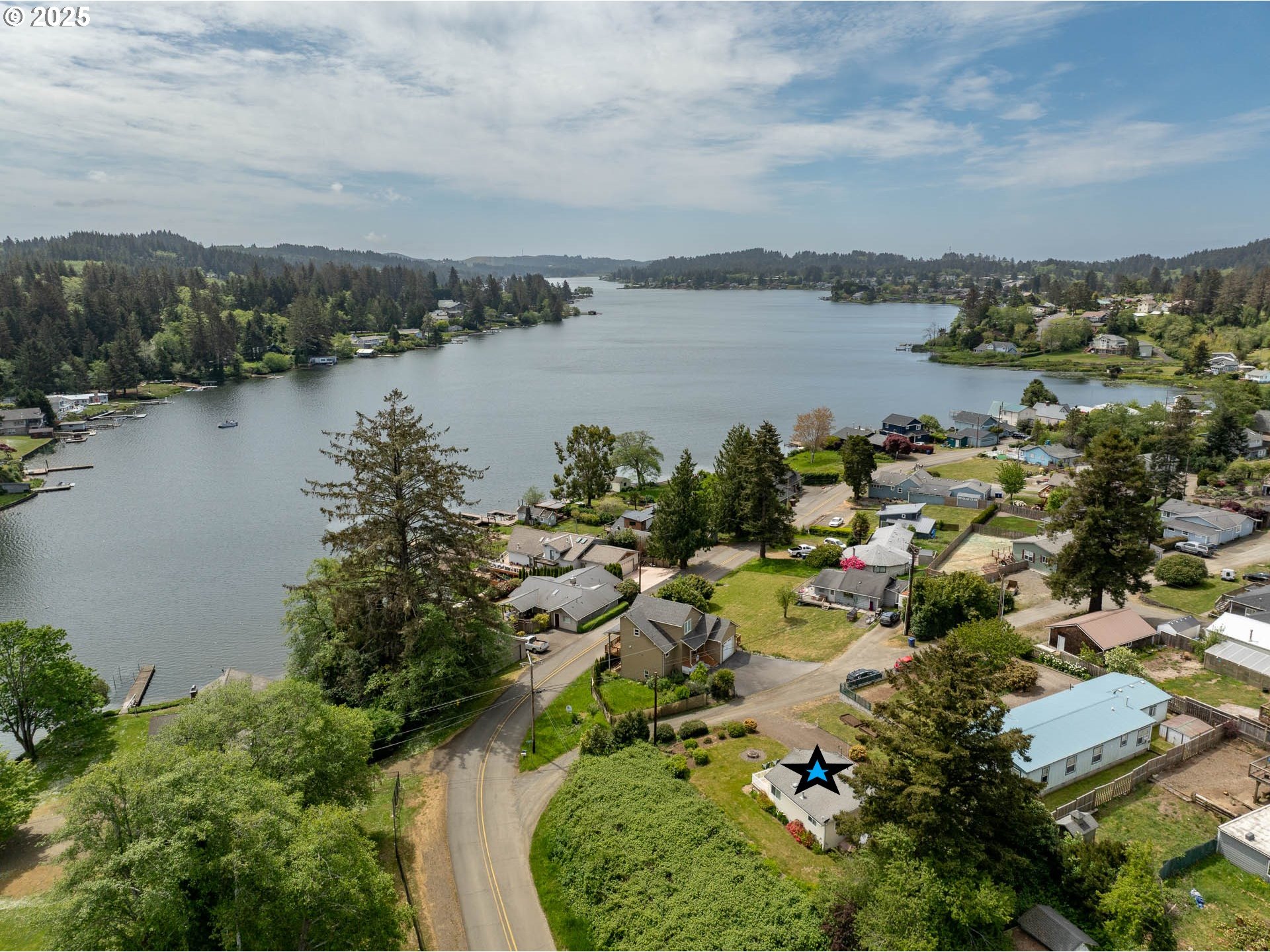 5305 Northeast 49th Street Neotsu, OR 97364 - Photo 4 of 32 a view of a lake with a city
