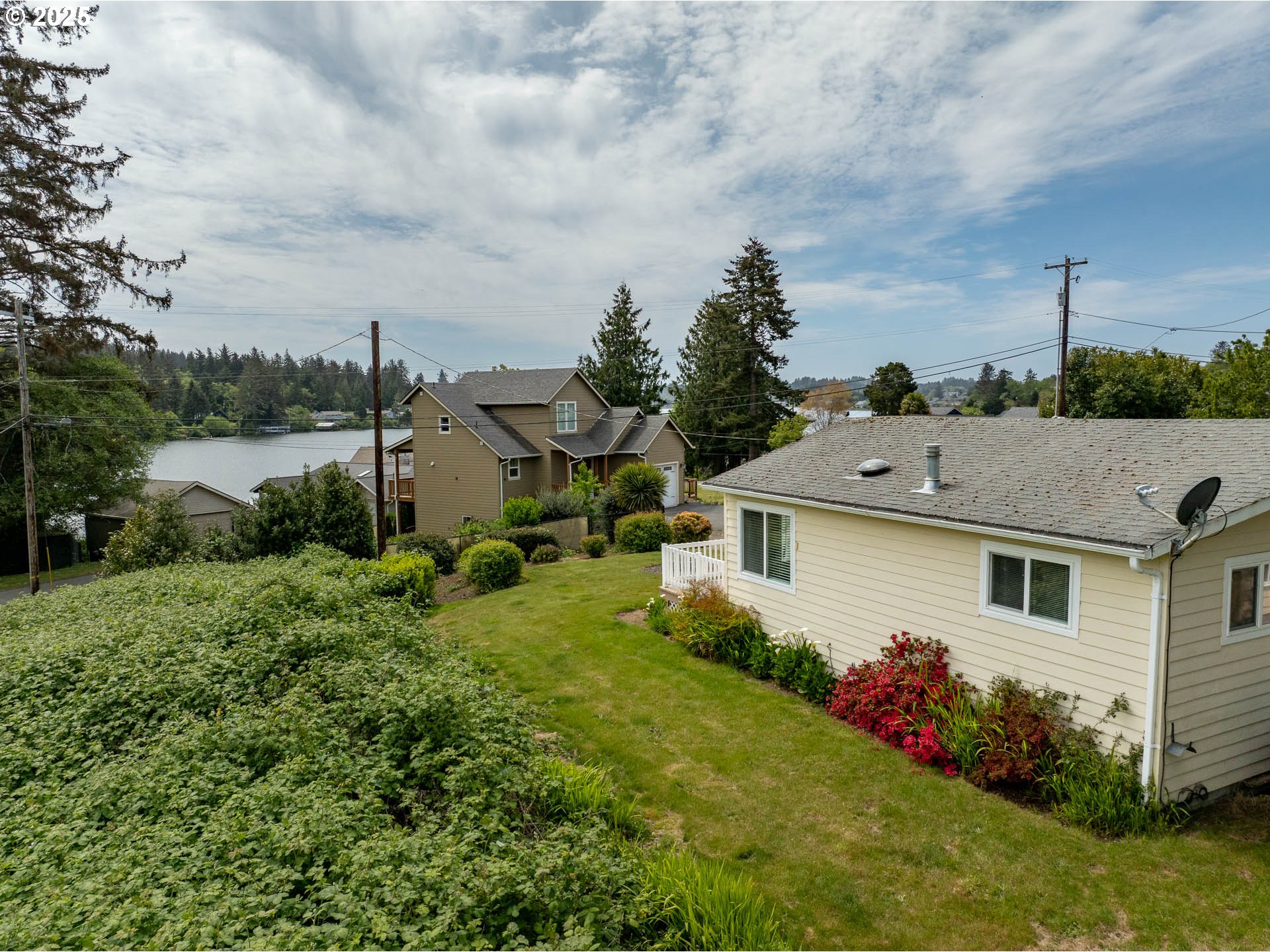 5305 Northeast 49th Street Neotsu, OR 97364 - Photo 5 of 32 a aerial view of a house with garden