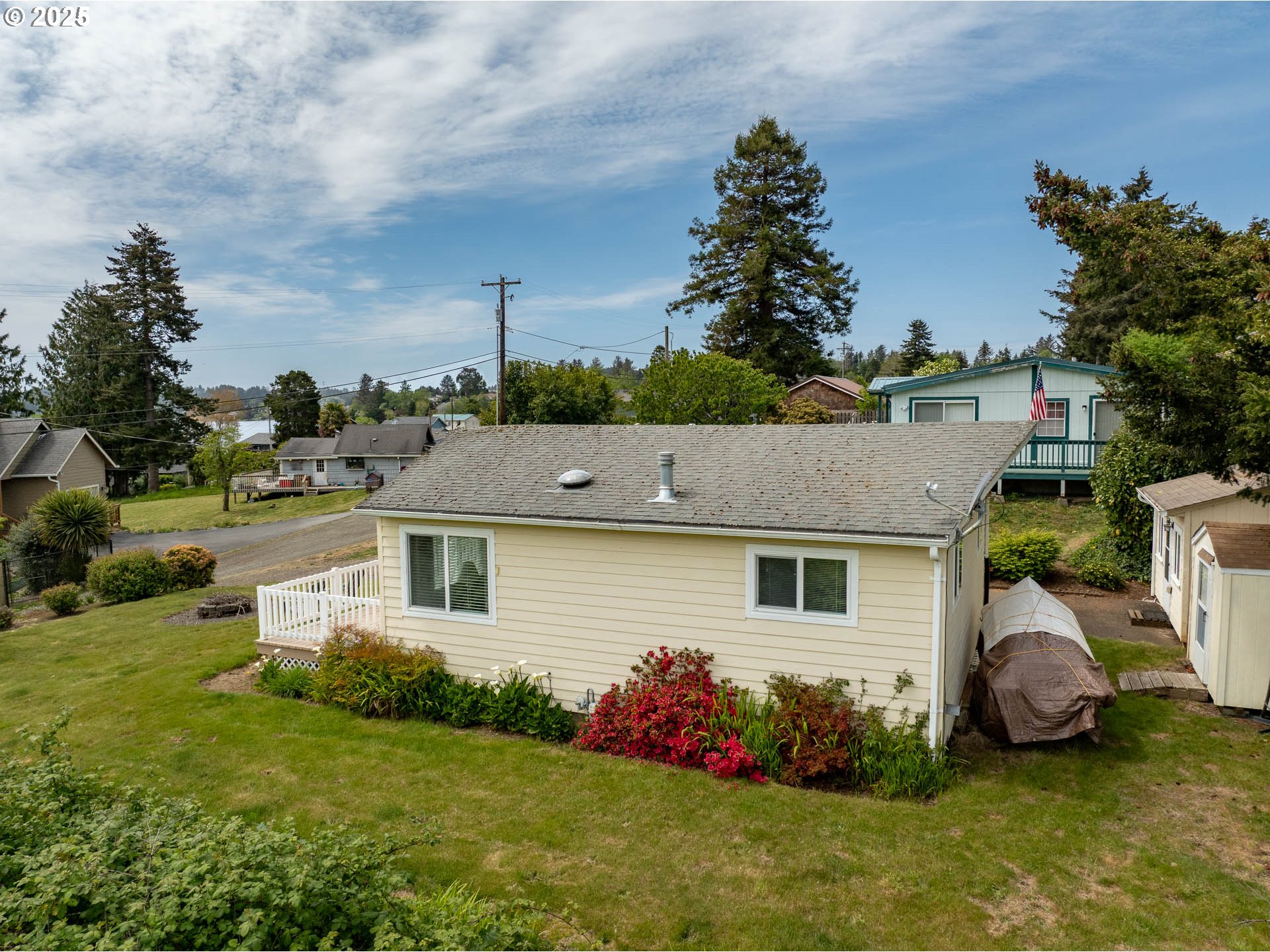 5305 Northeast 49th Street Neotsu, OR 97364 - Photo 6 of 32 a aerial view of a house with garden