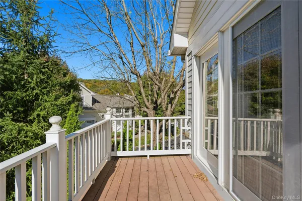 a spacious bathroom with a tub sink and mirror