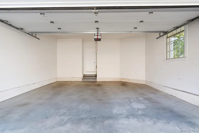 a view of a swimming pool and lounge chairs