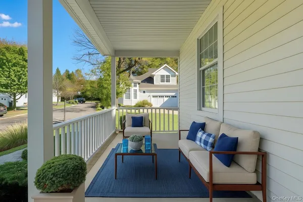 a view of a chair and table in the balcony