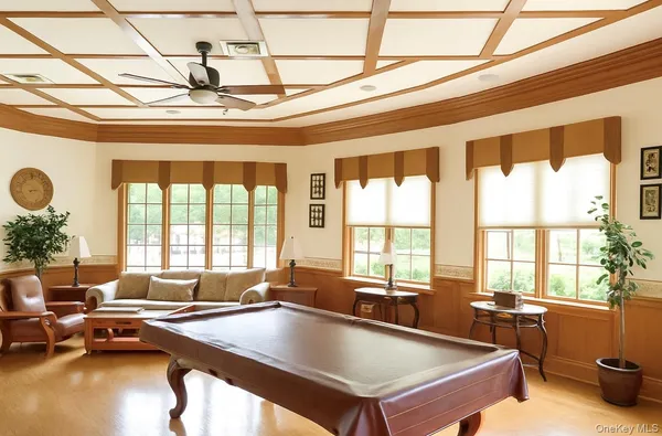 an aerial view of a house with a yard basket ball court and outdoor seating