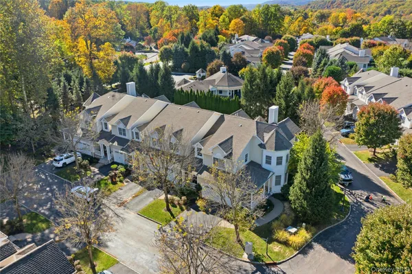 an aerial view of residential house with outdoor space and swimming pool