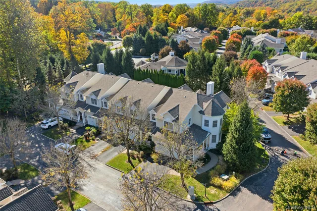 an aerial view of residential house with outdoor space and swimming pool