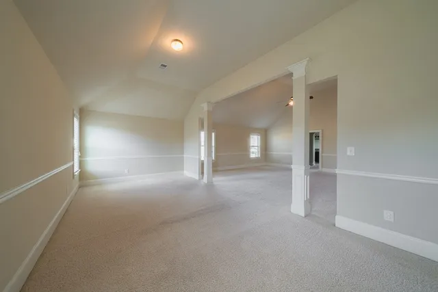 a view of a hallway view with wooden floor and staircase