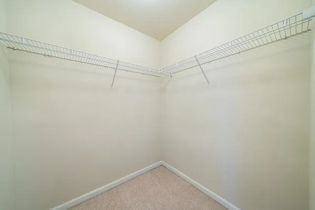 a bathroom with a double vanity sink and mirror