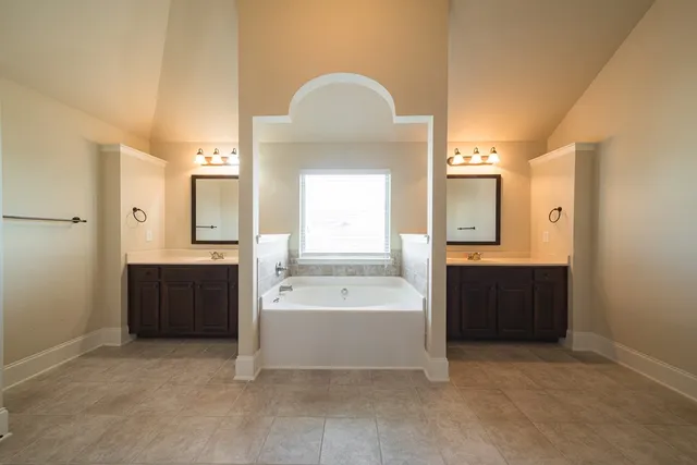 a bathroom with a bathtub and a sink