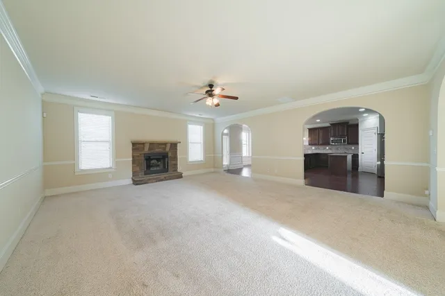 a view of a livingroom with furniture and a fireplace