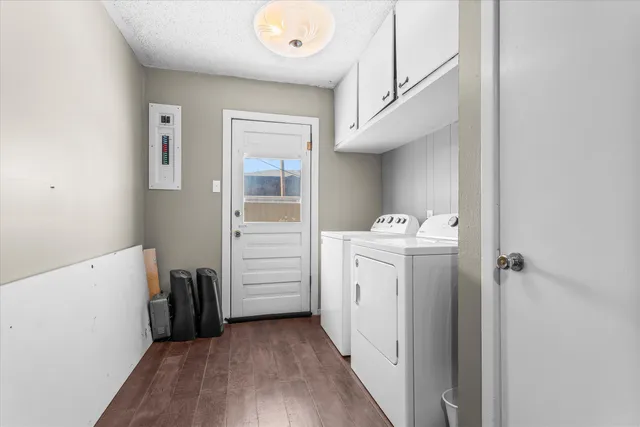 a view of a hallway with closet and utility room