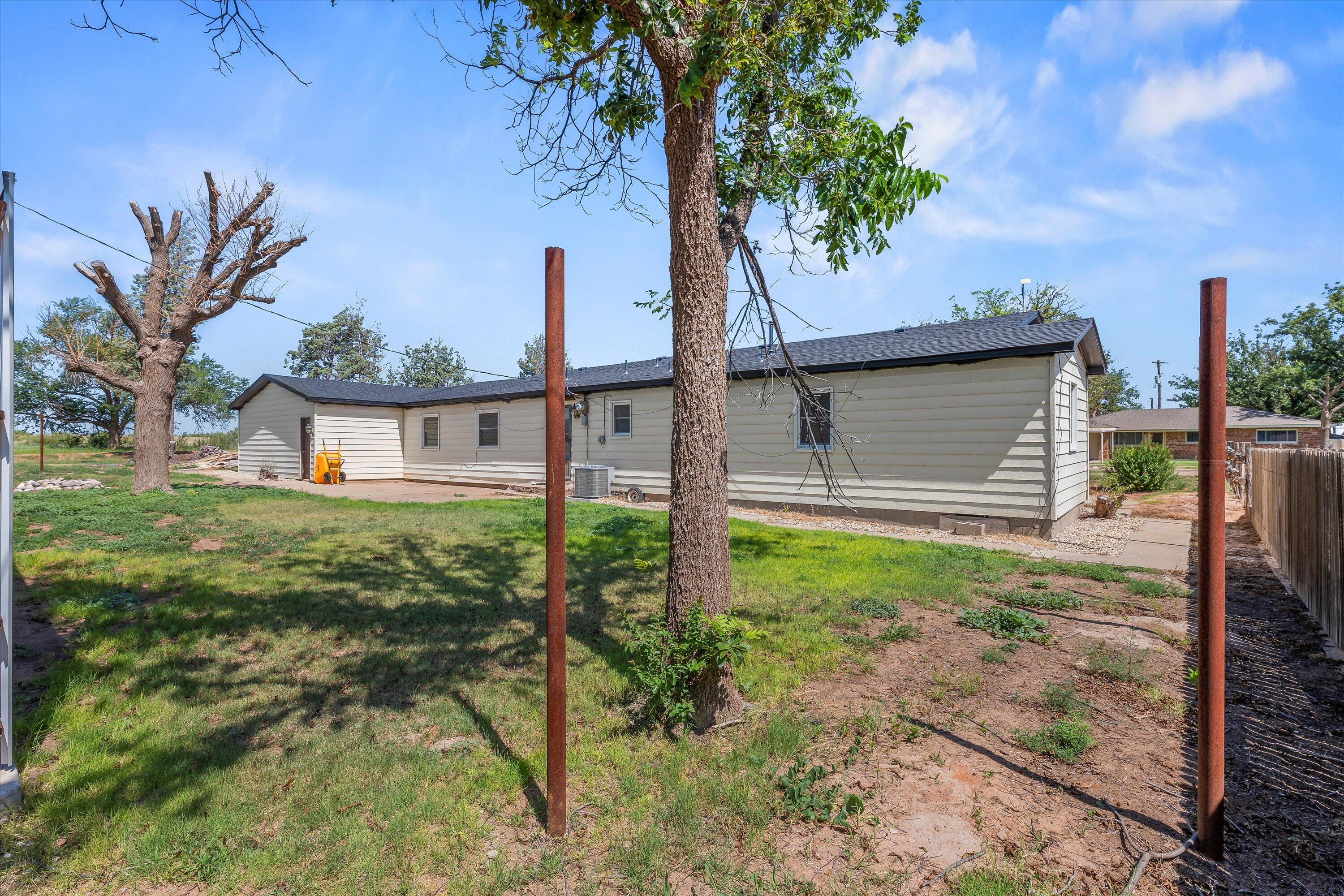 102 3rd Street Plains, TX 79355 - Photo 24 of 27 a house view with a garden space
